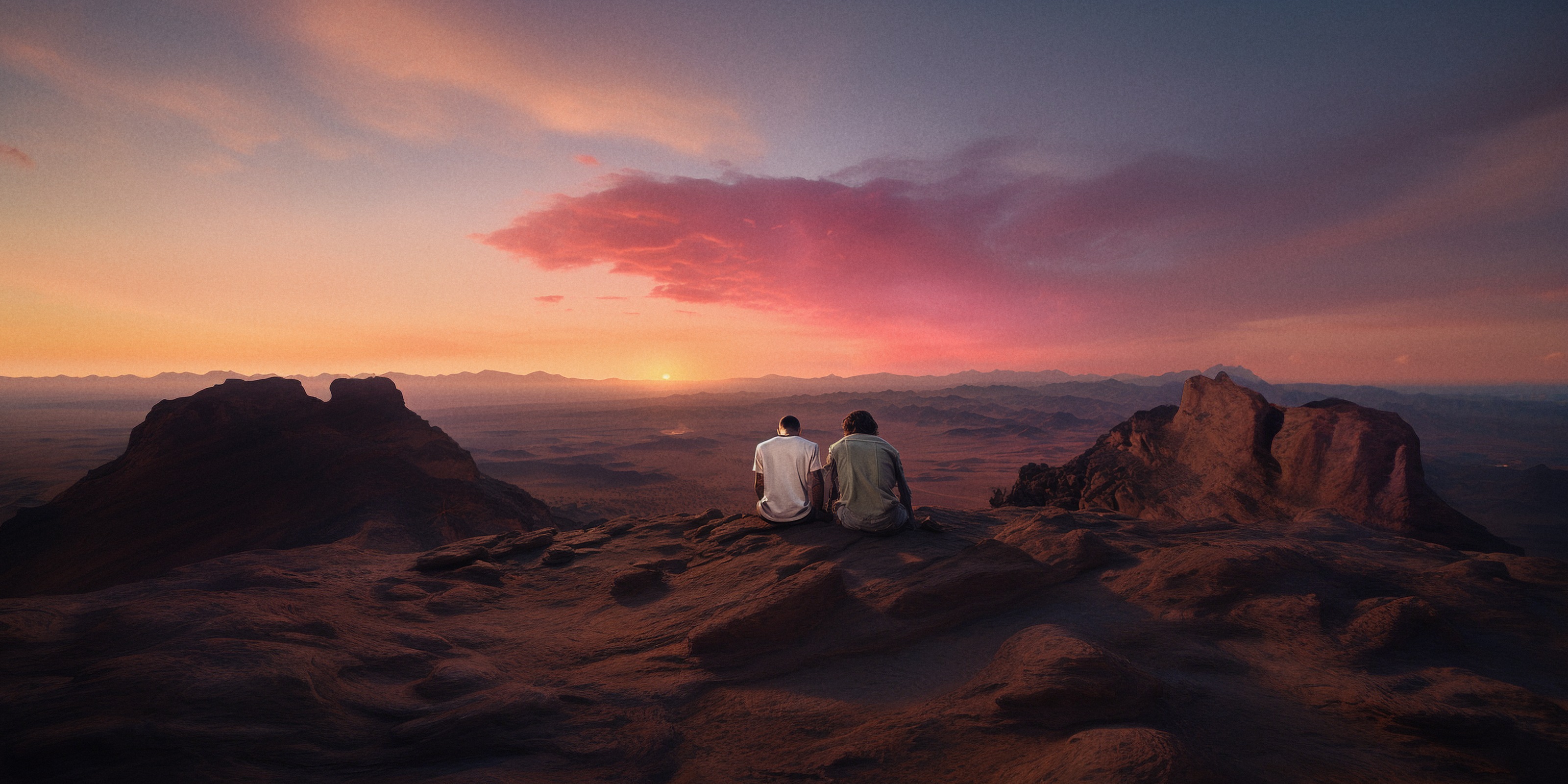 Lou and Gabby together overlooking the canyon at sunset.